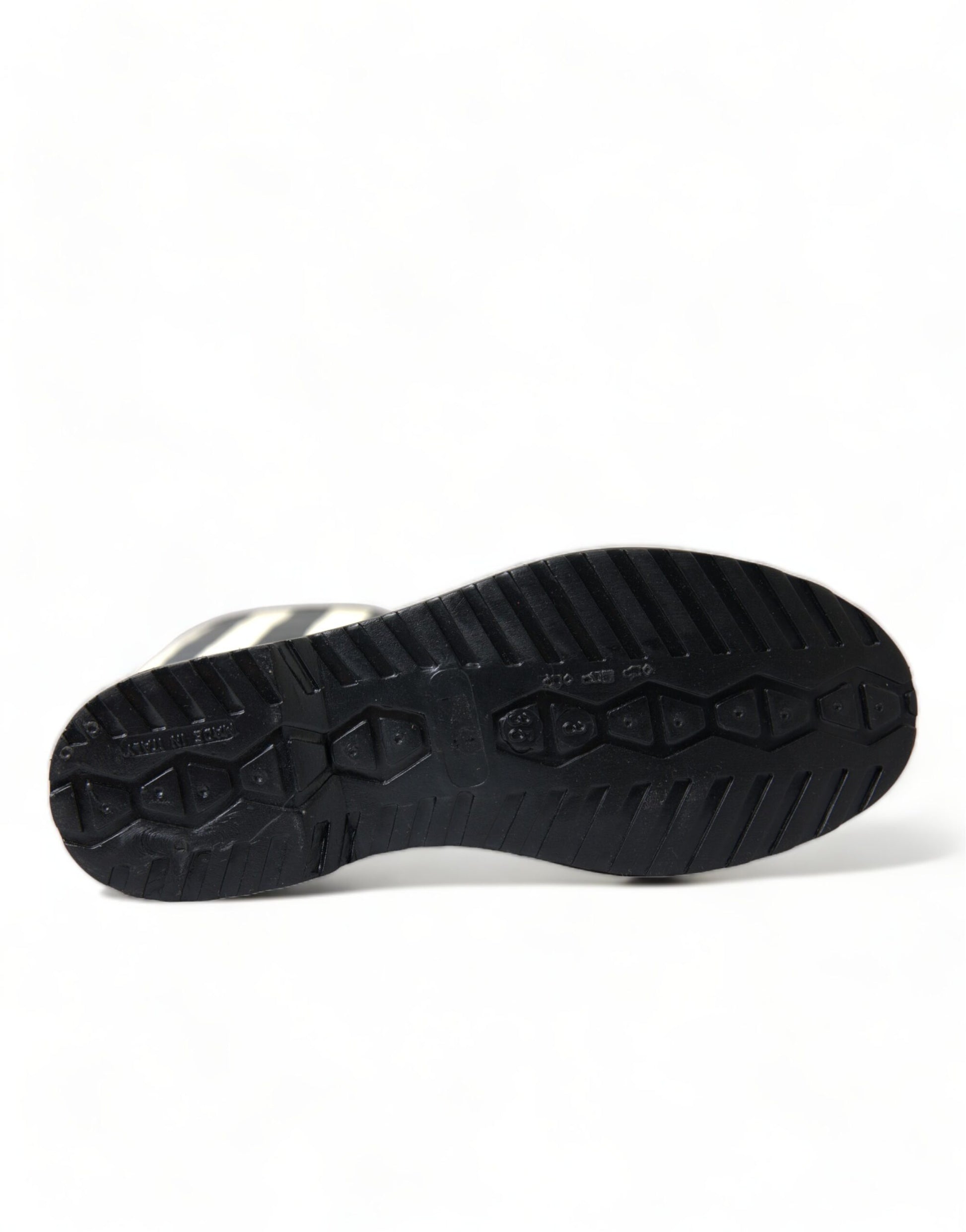 Black shoe with a deep tread pattern on the sole