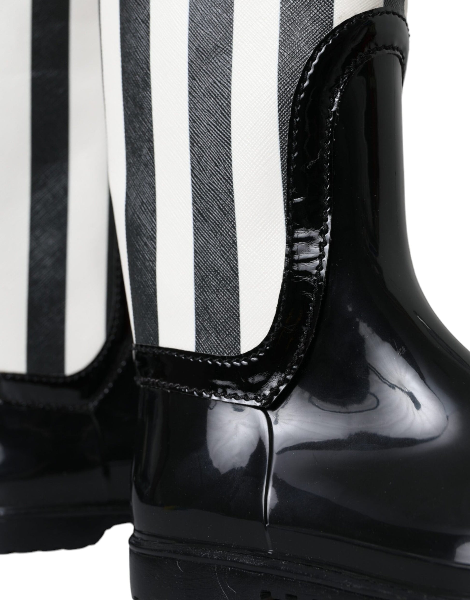 Black boot with white stripes on sides