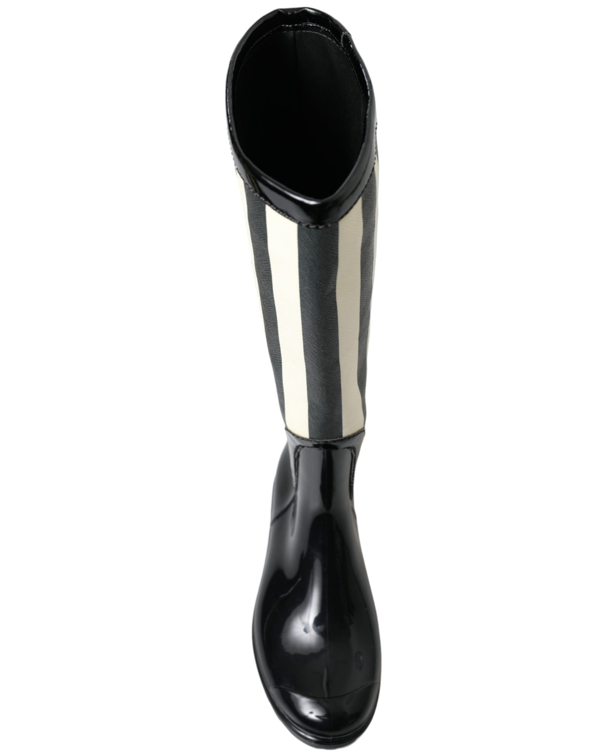 Black and white knee high boot with a round toe