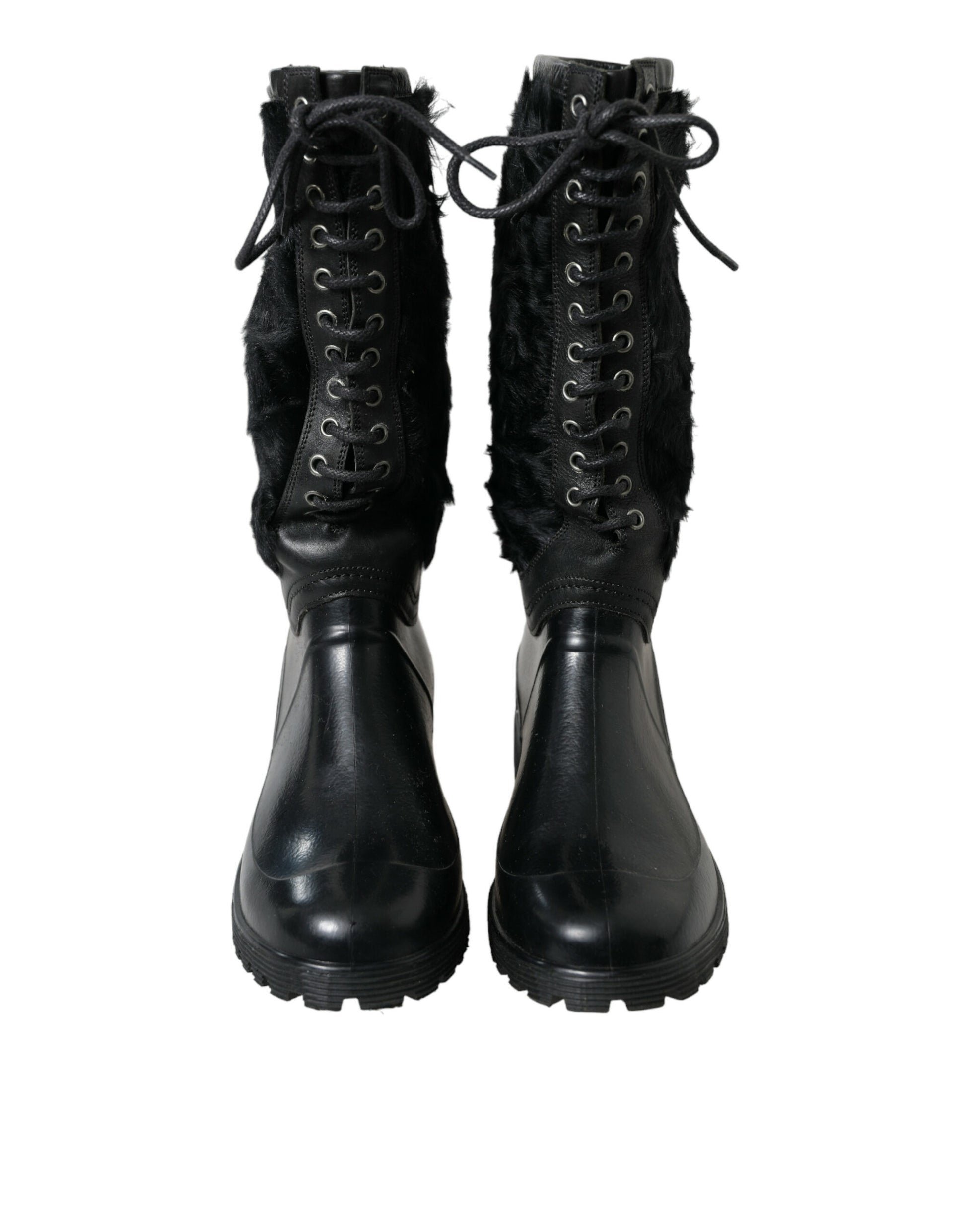 Pair of black leather boots with laces and fur trim around top