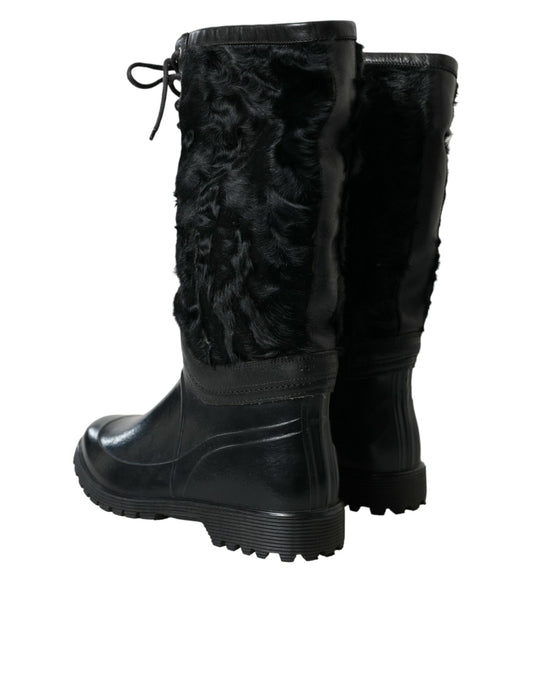 Pair of black furry boots with laces and a thick sole