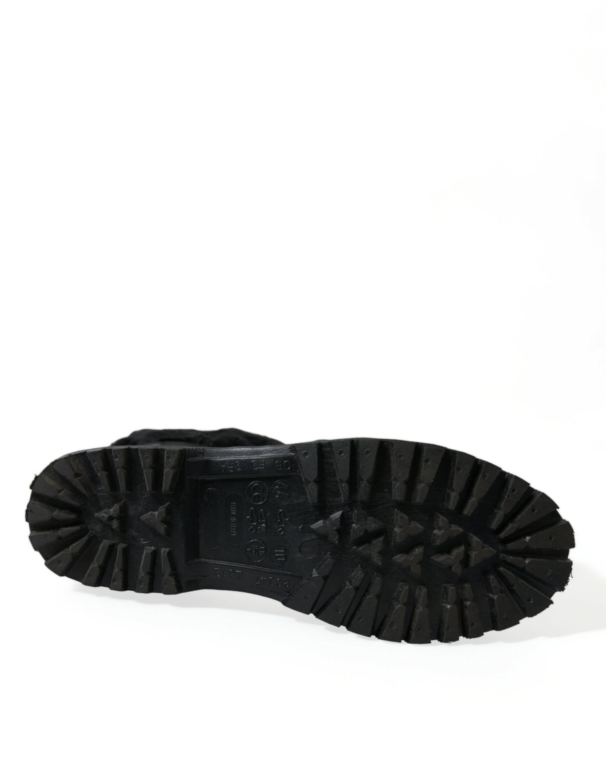 Black rubber boot with deep treads and a pull tab on top