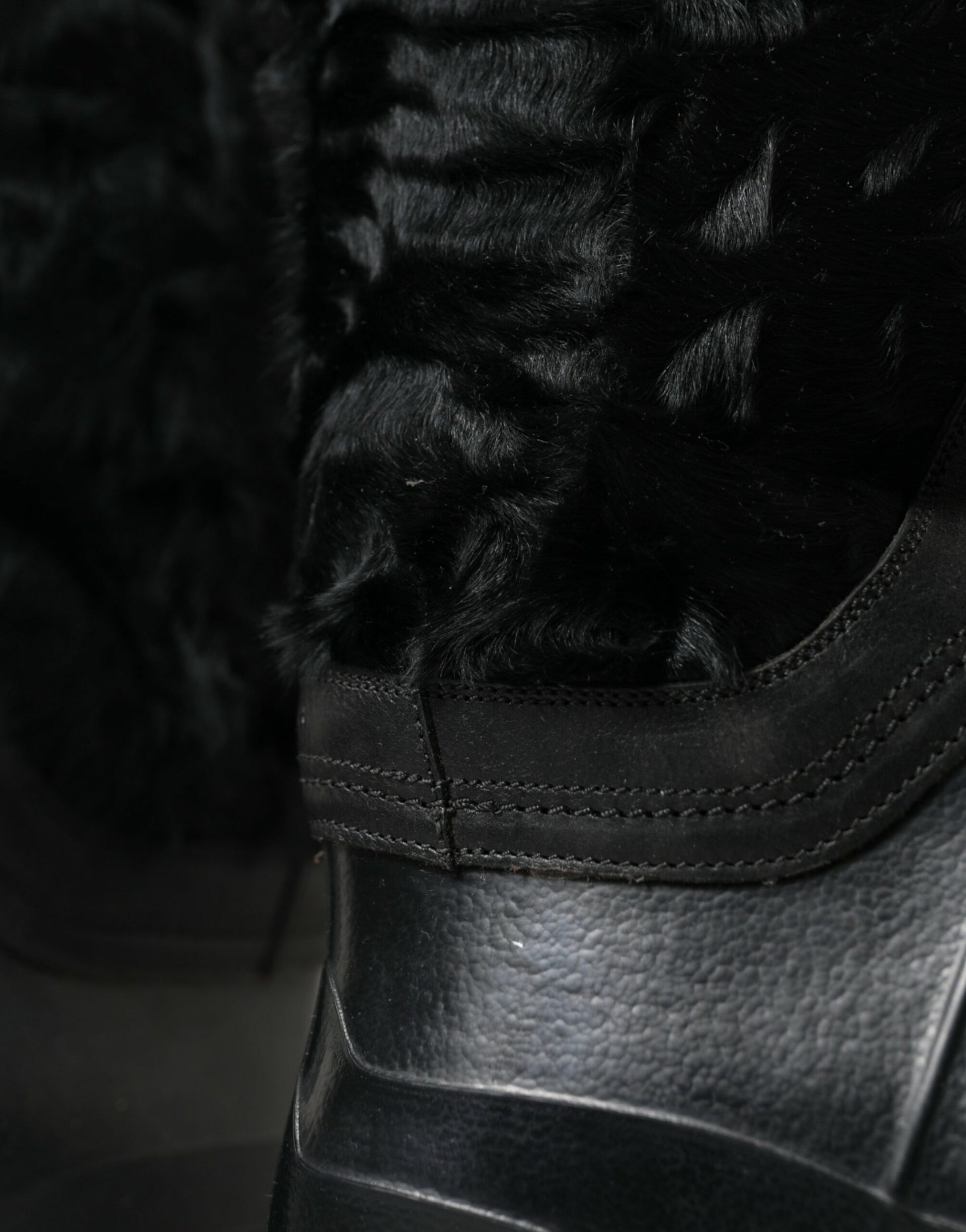 Black boot with fur trim and laces