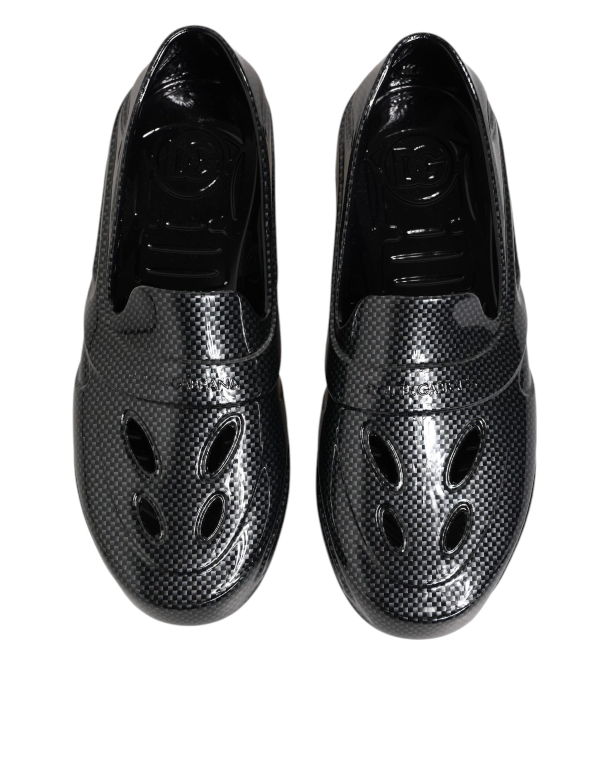 Pair of black shoes with holes on top for breathability