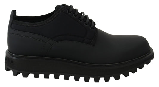 Black leather lace-up shoes with thick soles and a low heel