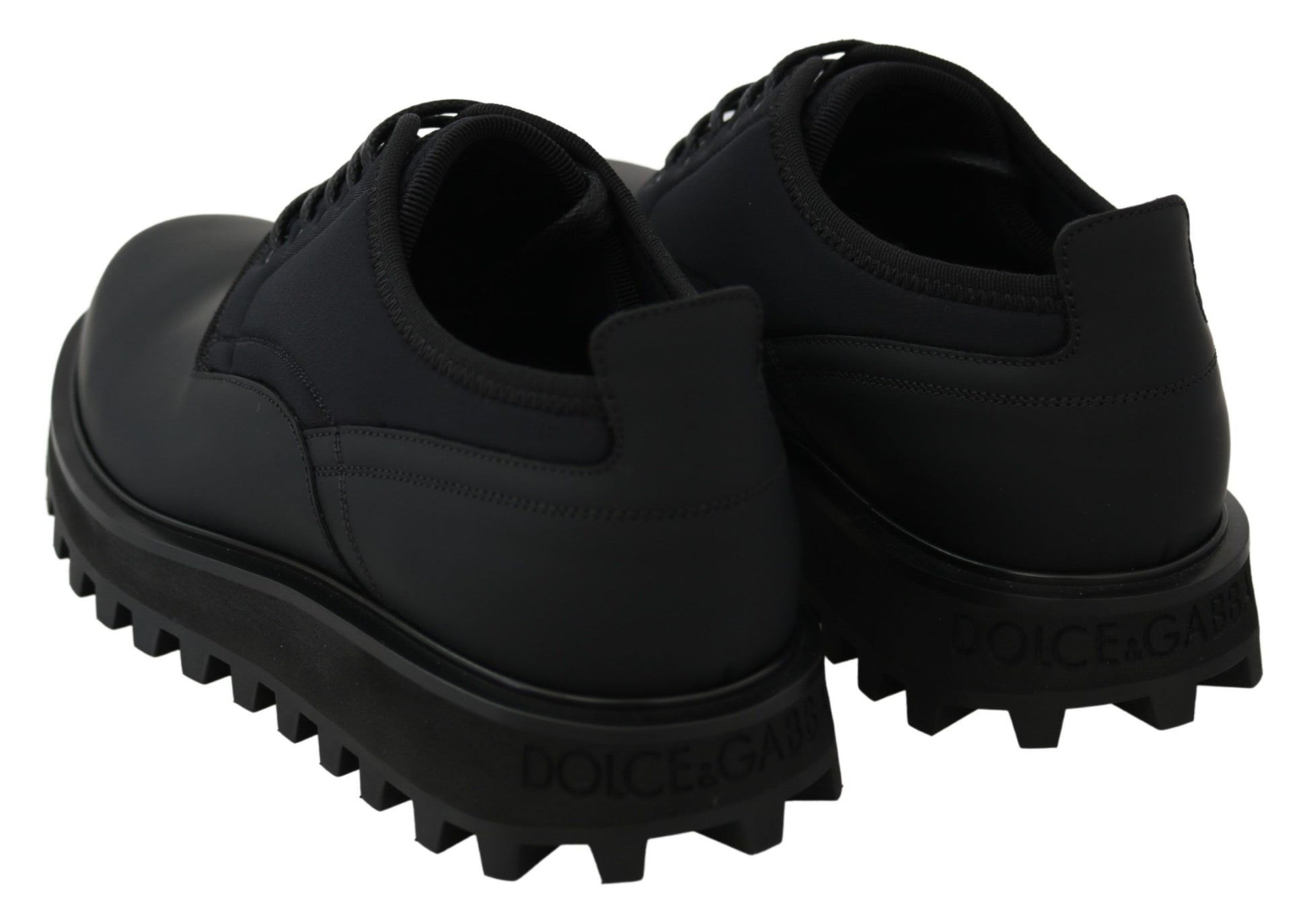 Pair of black shoes with white soles and laces
