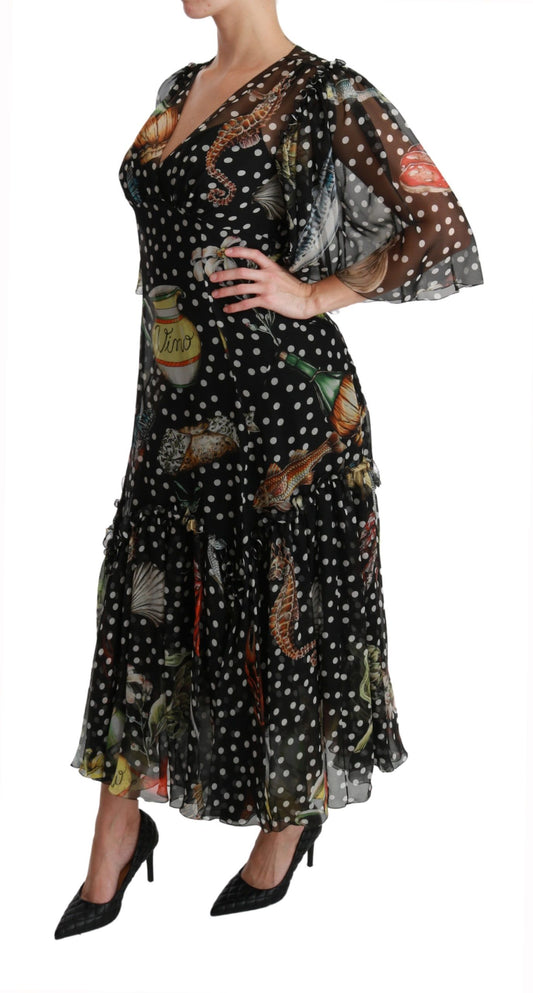 A black dress with a sea fish print, featuring a high neck and long sleeves
