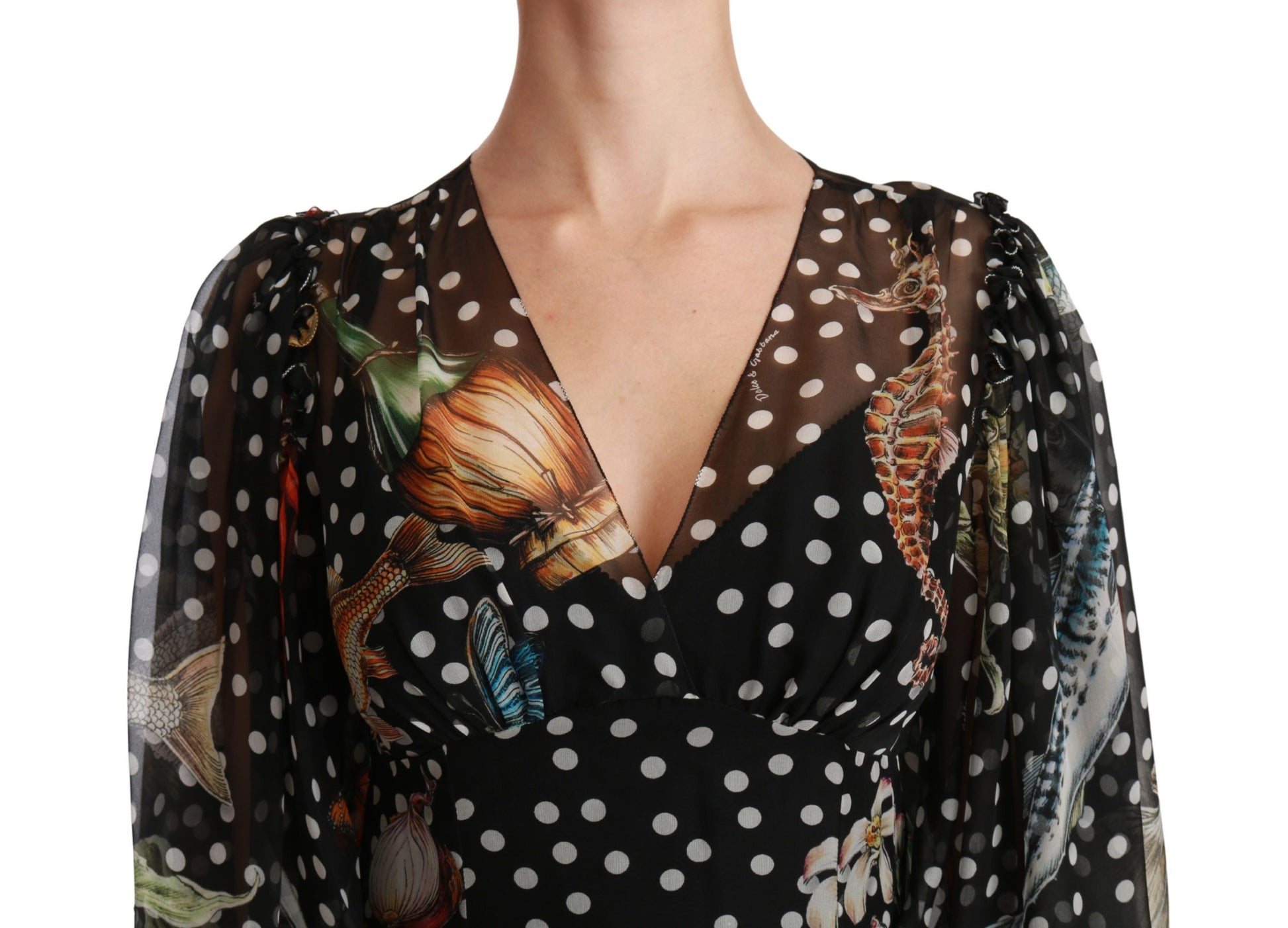 A black dress with a polka dot pattern, featuring a sea fish design on the front