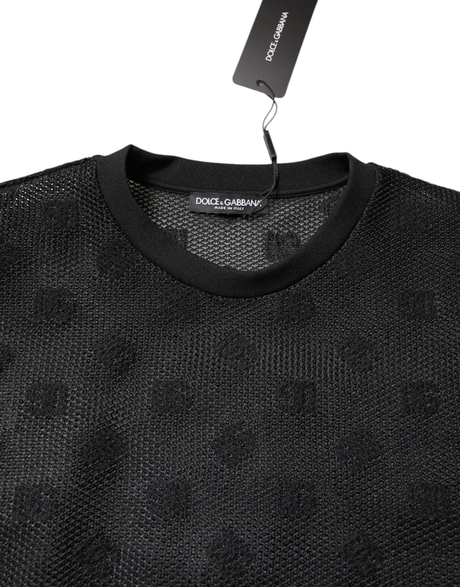 Black knit sweater on hanger