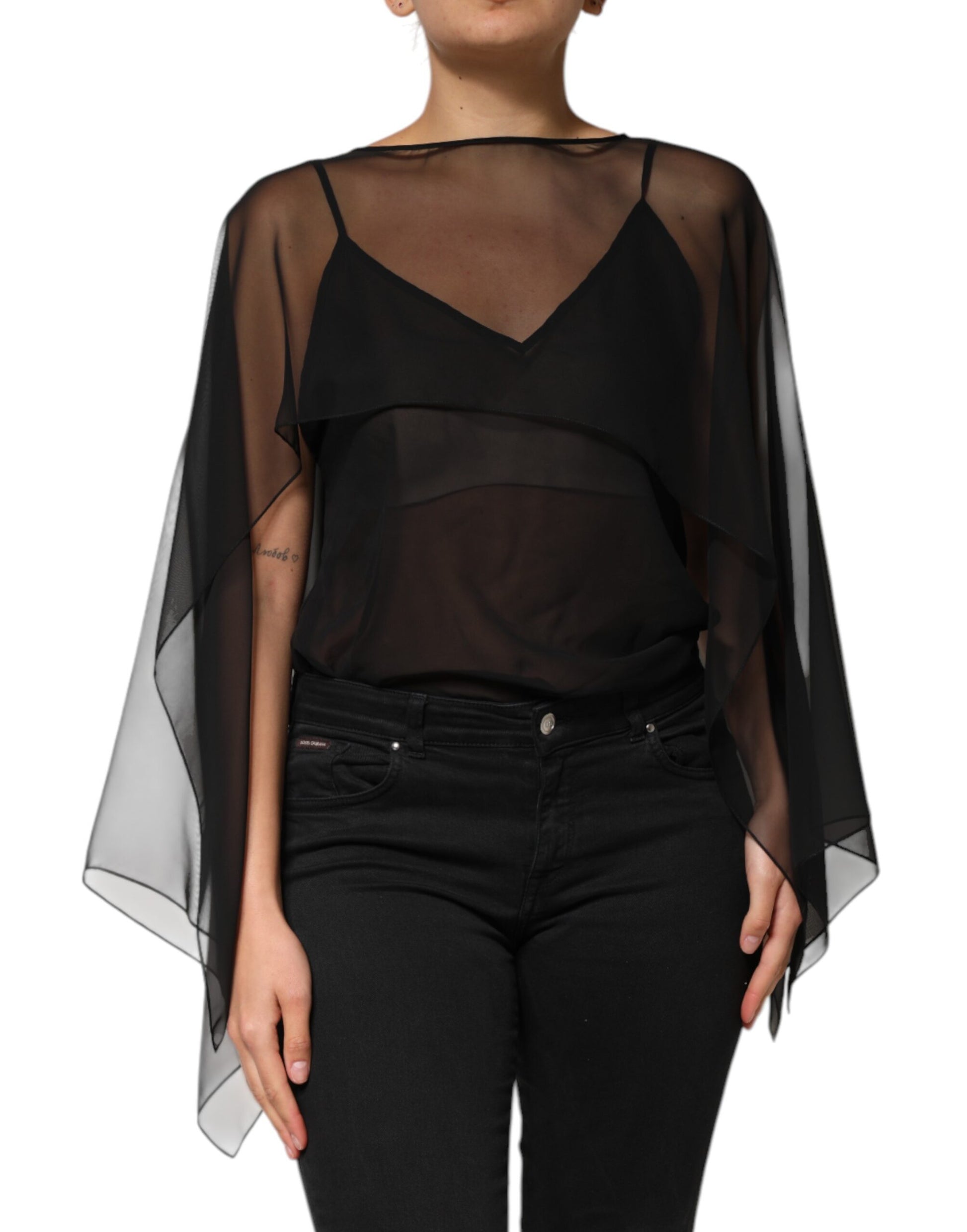 Black lace cape over black top and jeans