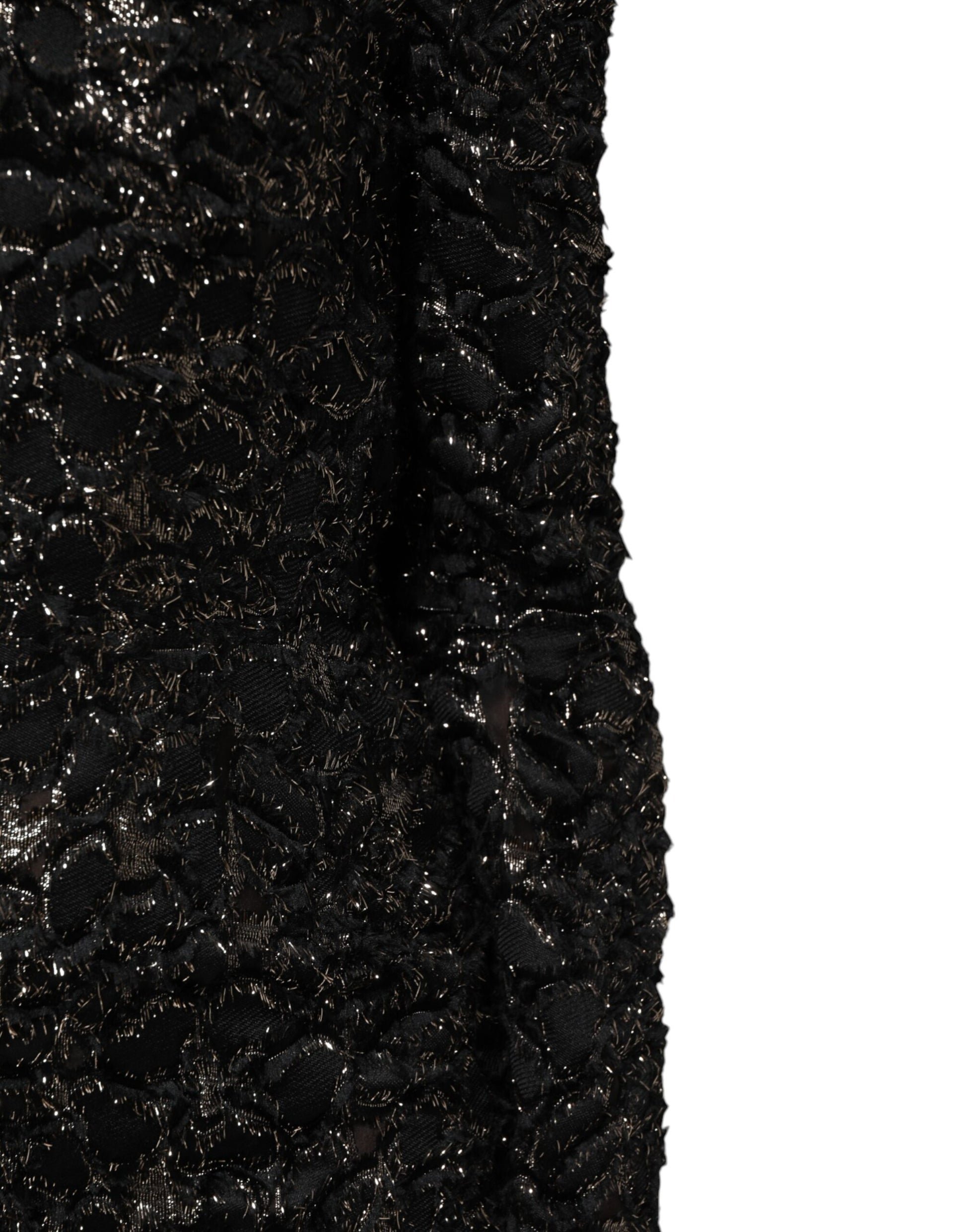 A black sequin bouclé tweed sheath dress with a V-neckline