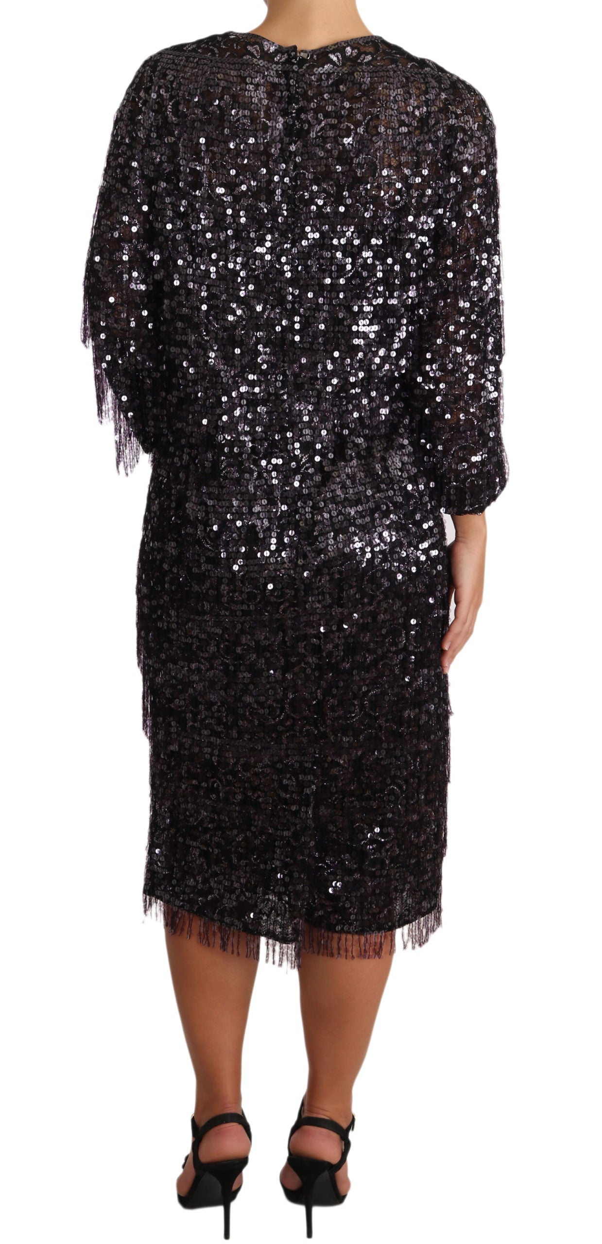 Black sequined dress with fringe detailing at hem