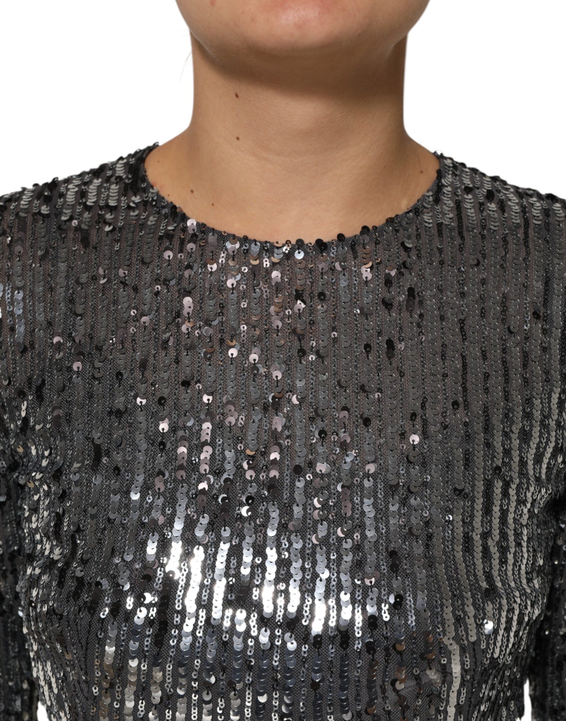 A black sequined midi dress with long sleeves
