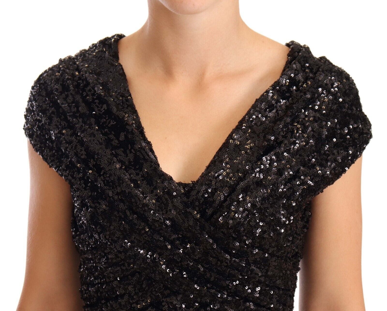 Black sequined dress on a woman's shoulders