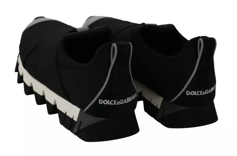 Pair of black sneakers with white soles, featuring the Dolce & Gabbana logo