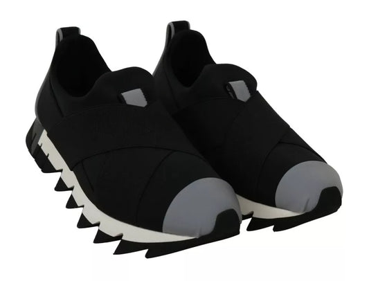 Pair of black sneakers with white sole, featuring a shark design on the side
