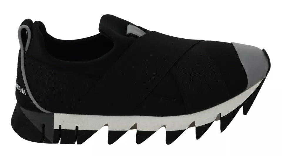 Black shoe with white sole, featuring a unique design resembling a shark's mouth