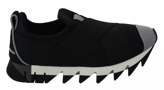 Black shoe with white sole, featuring a unique design resembling a shark's mouth