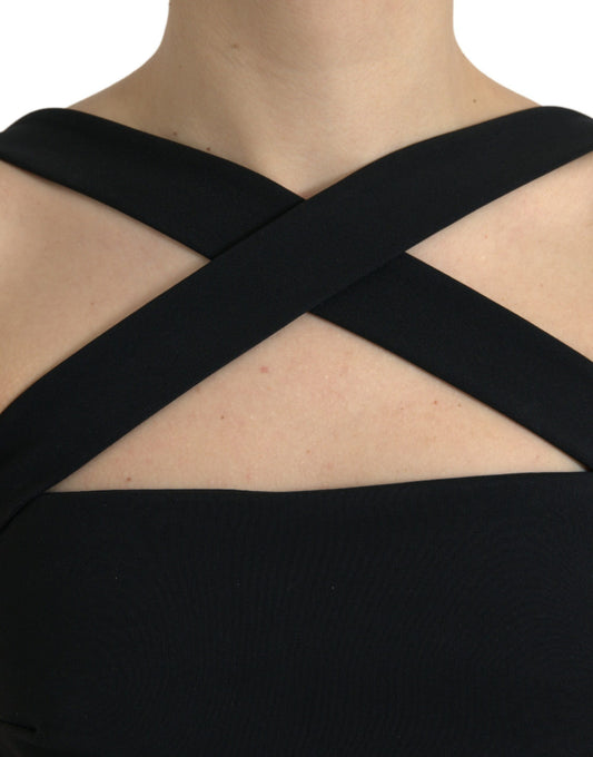 A black sheath halter sleeveless midi dress with a cross-over neckline