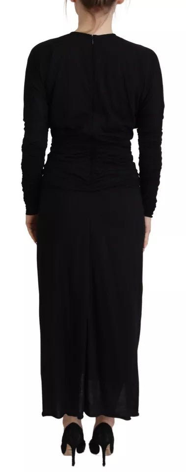A black midi dress with a wrap style and wool material