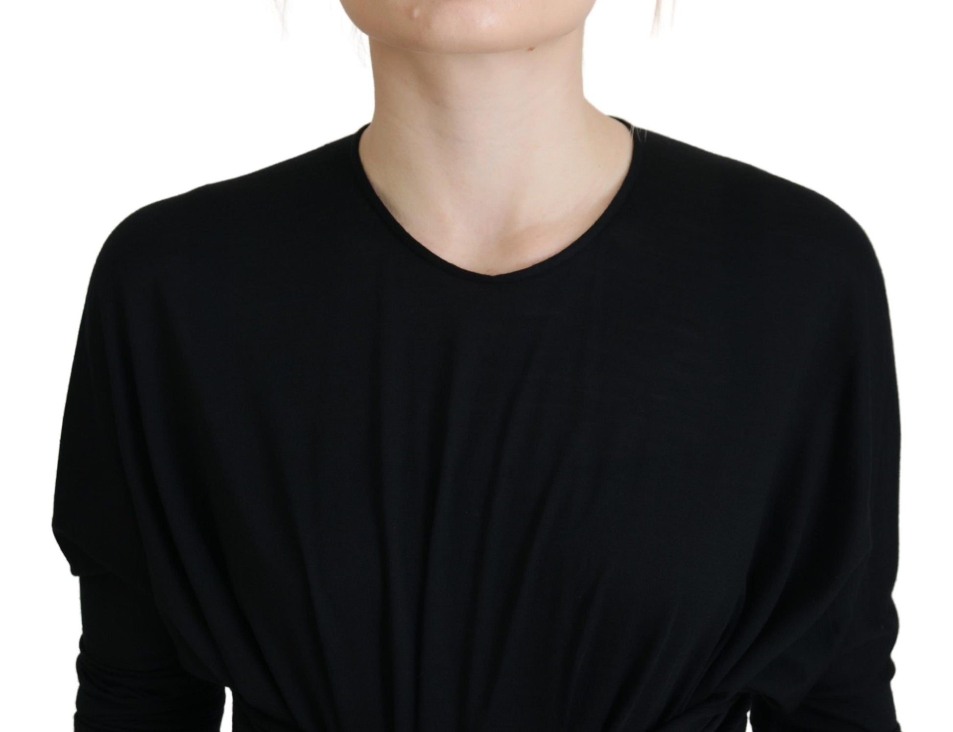 A black midi dress with a wrap style and wool material