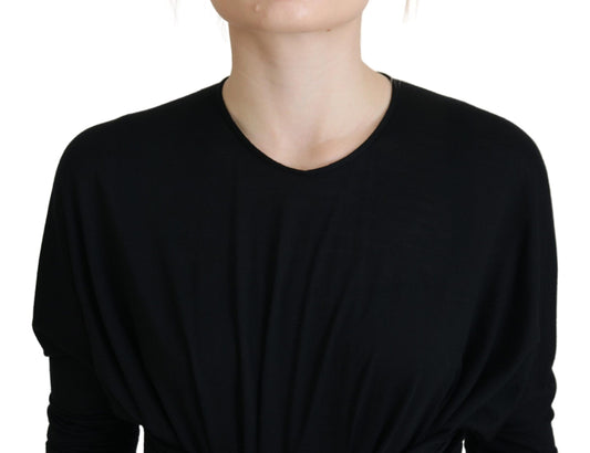 A black midi dress with a wrap style and wool material
