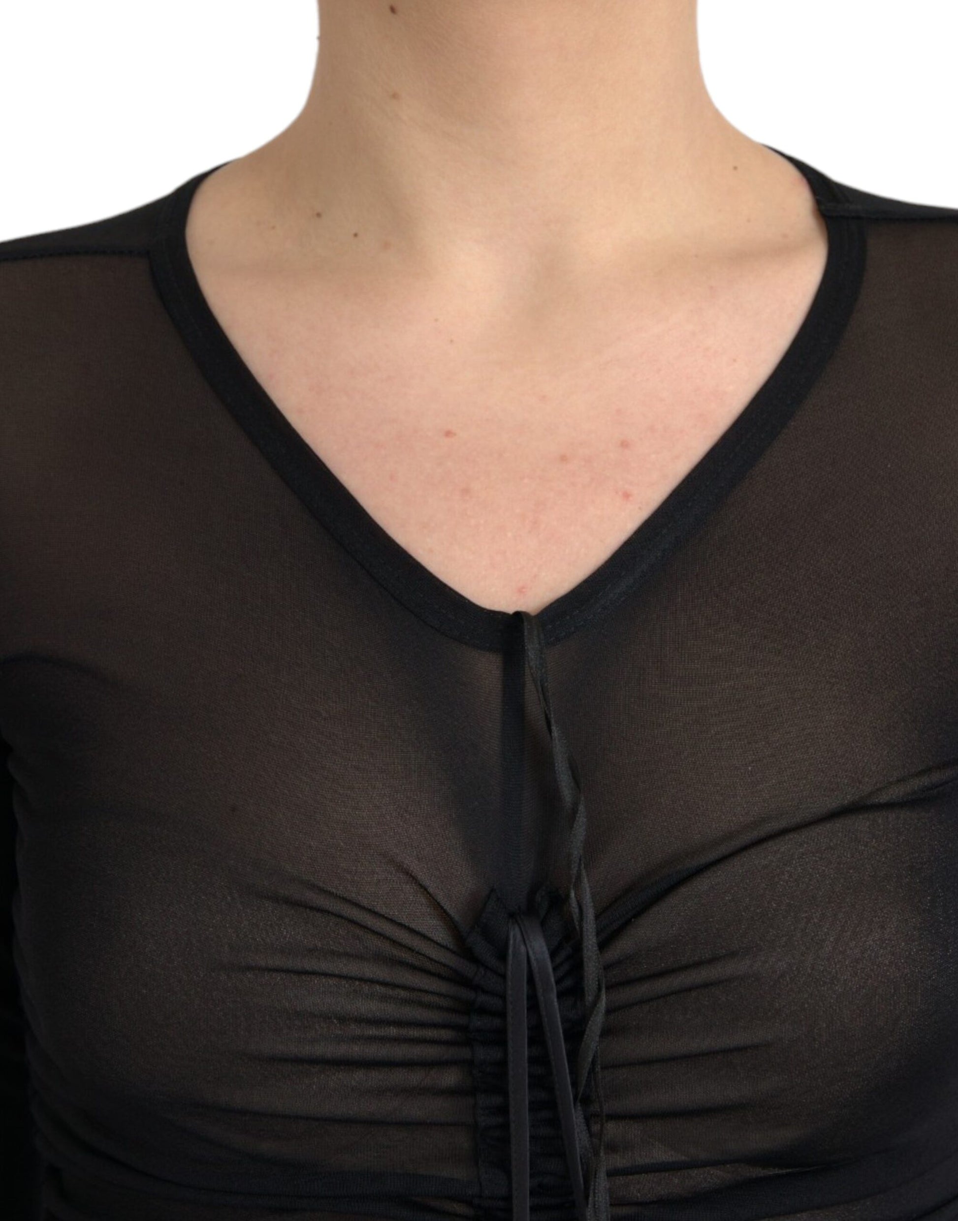 A black sheer bodycon midi dress with a zipper detail on the front