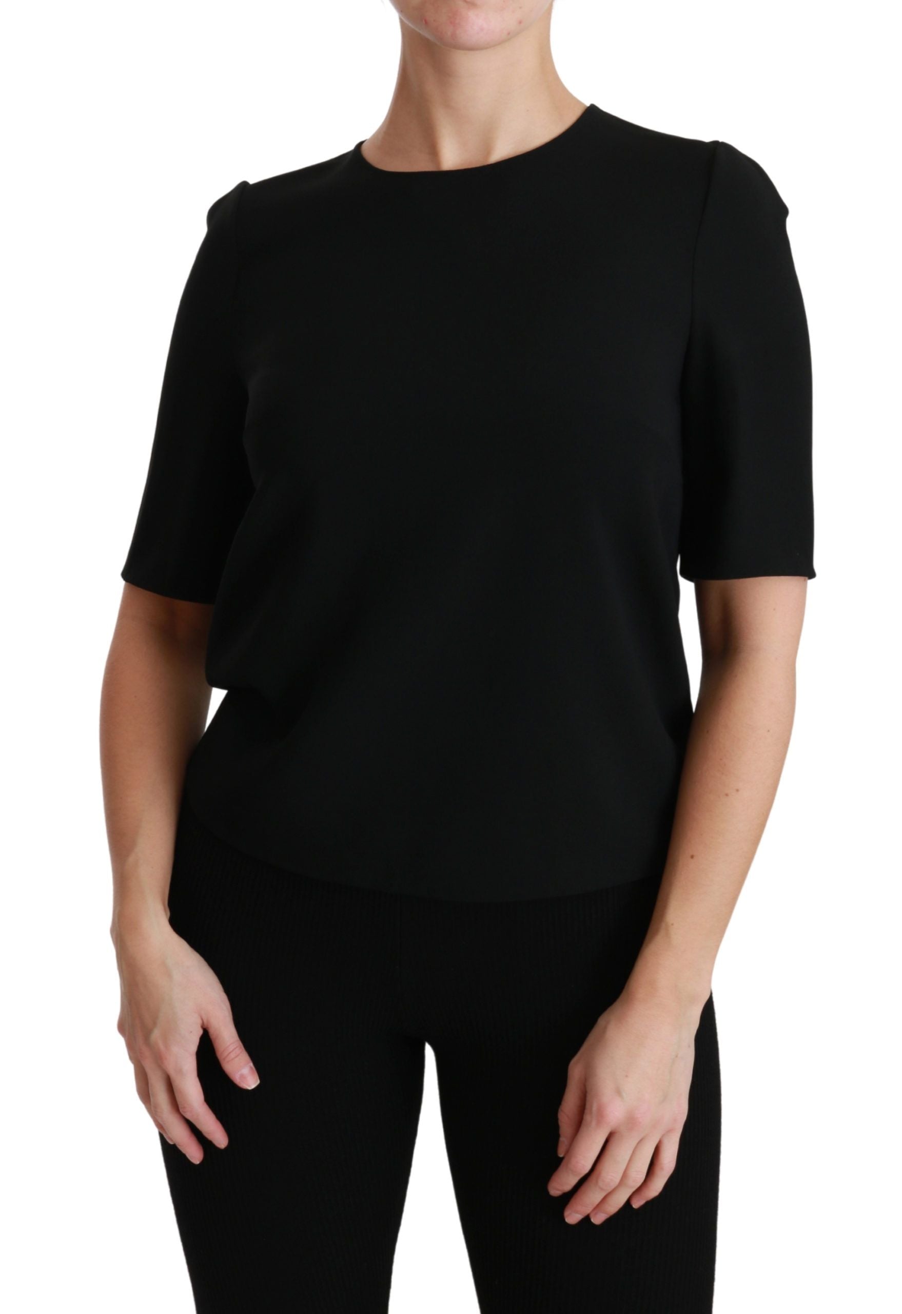 Woman wearing black top and pants