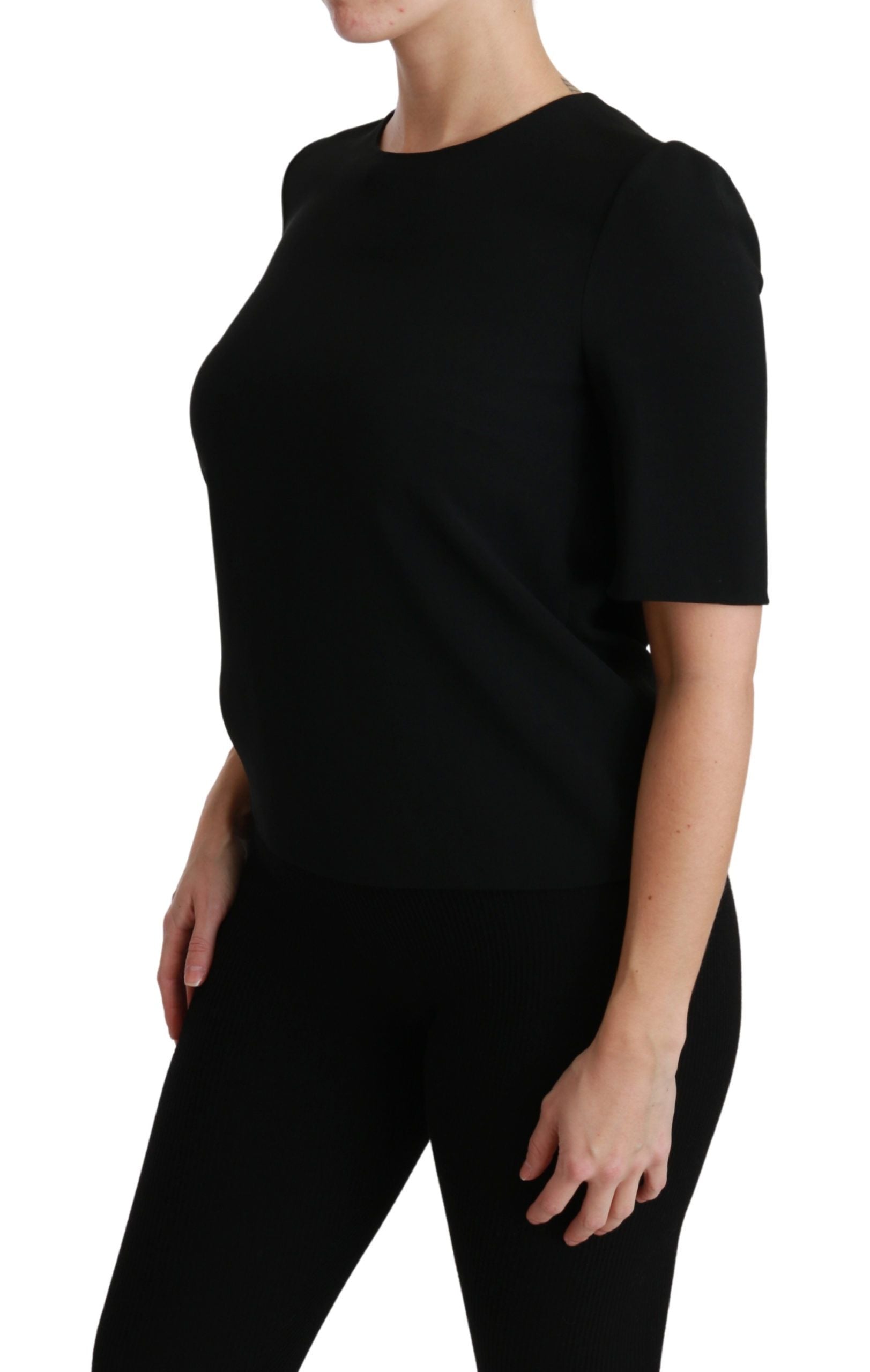 Black sleeveless top on a woman