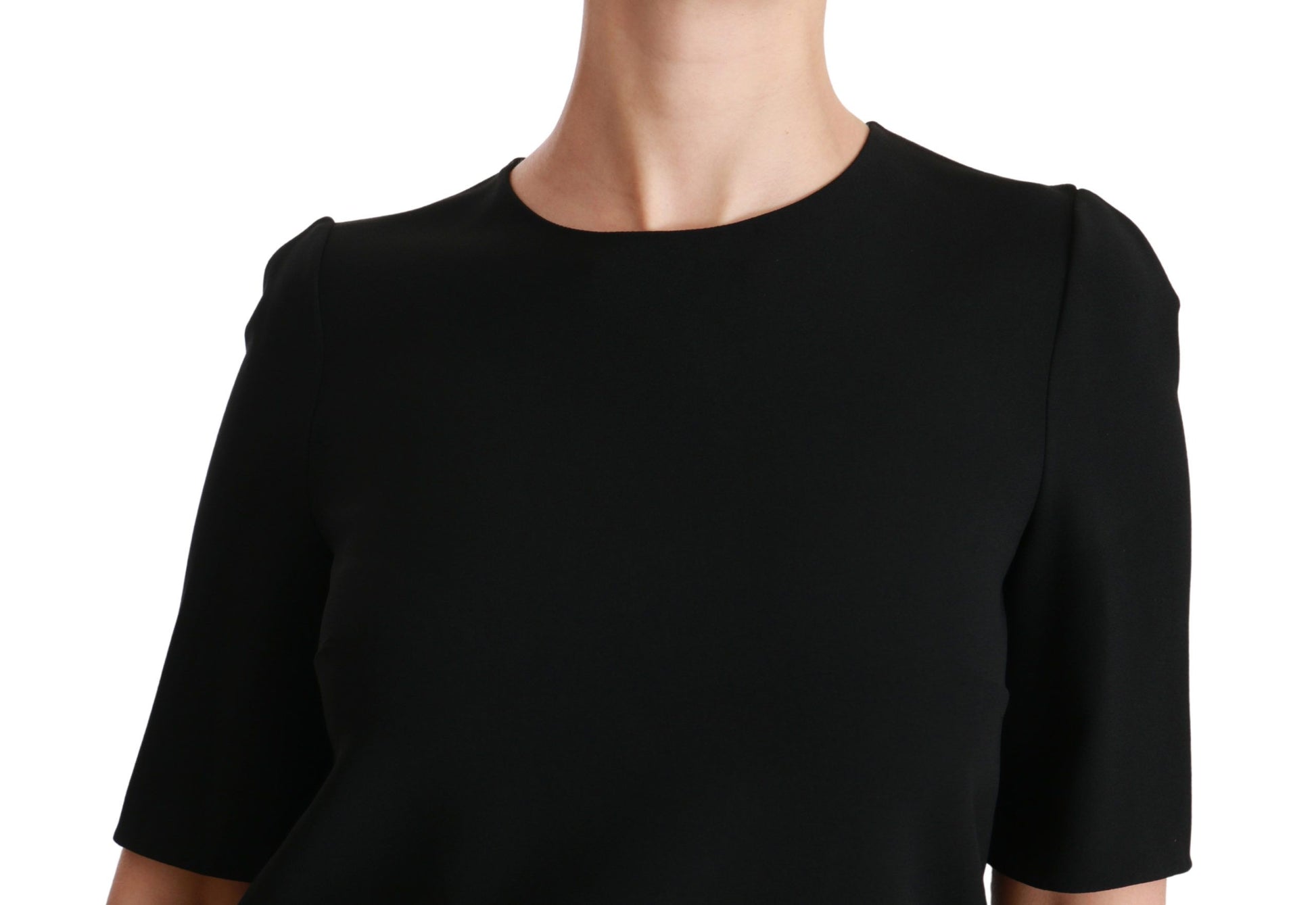 Black short sleeve dress on a mannequin
