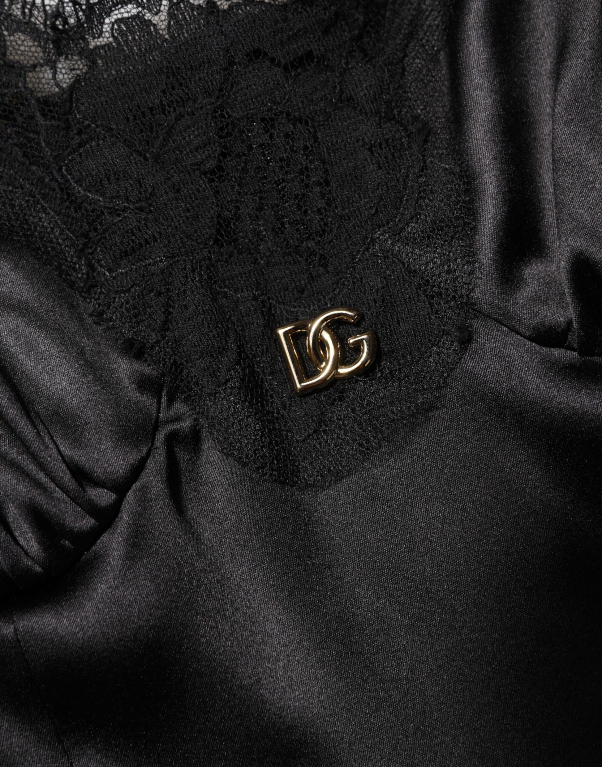 A black lace trim sleeveless mini dress by Dolce & Gabbana
