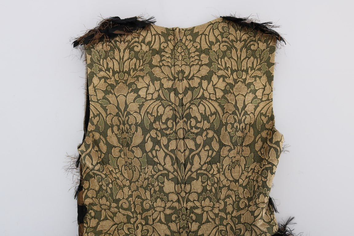 Old fabric with gold embroidery on a white background