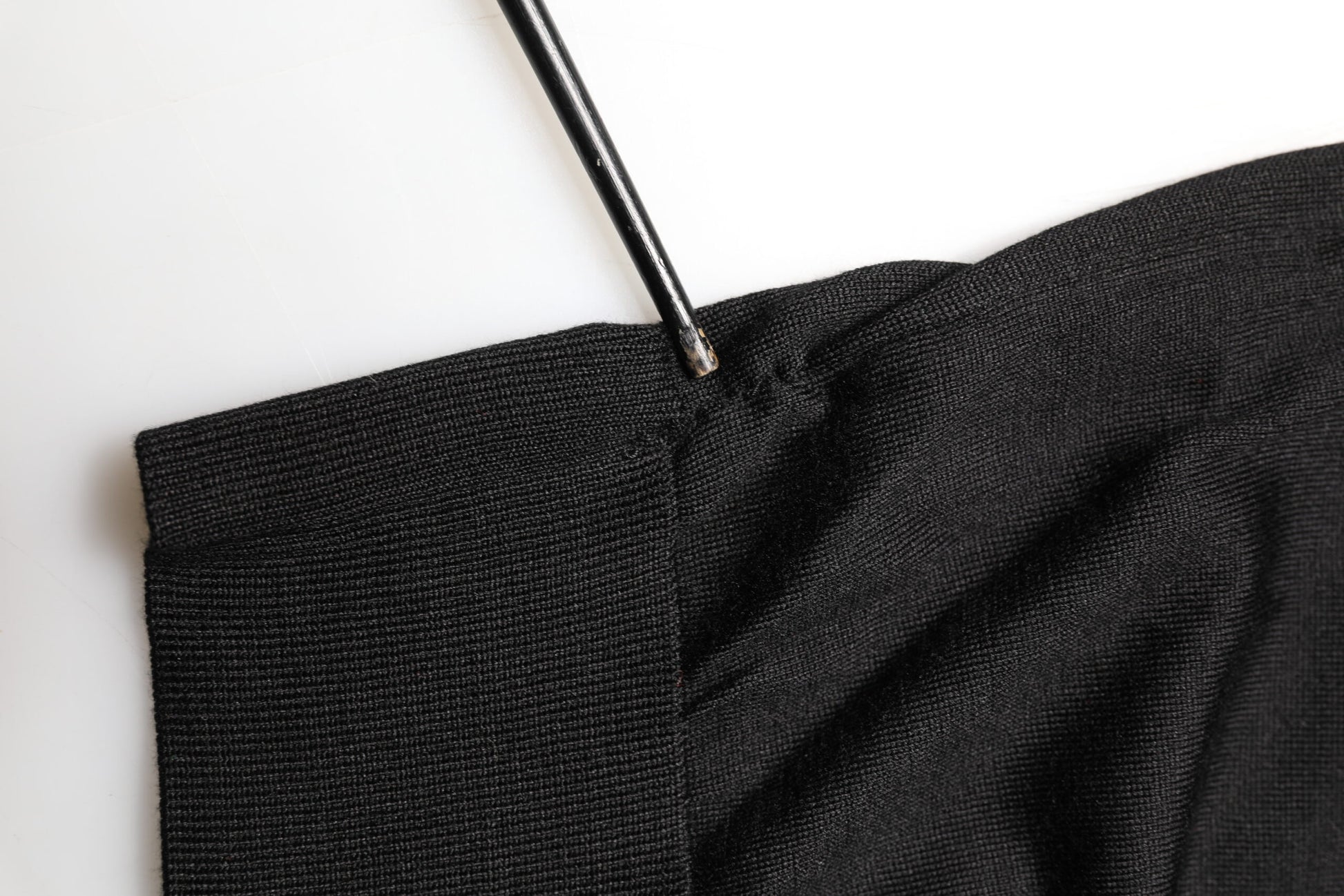Black fabric with a pin in it
