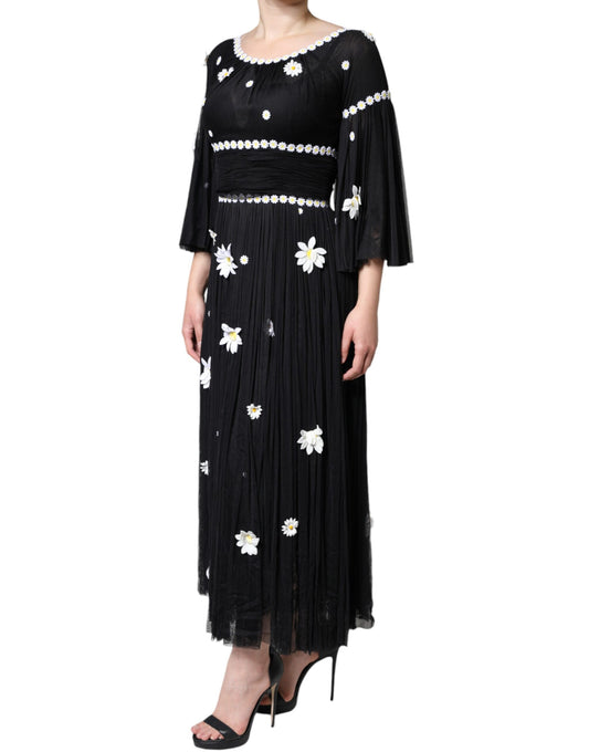 A black silk dress with daisy embroidery and a flared skirt
