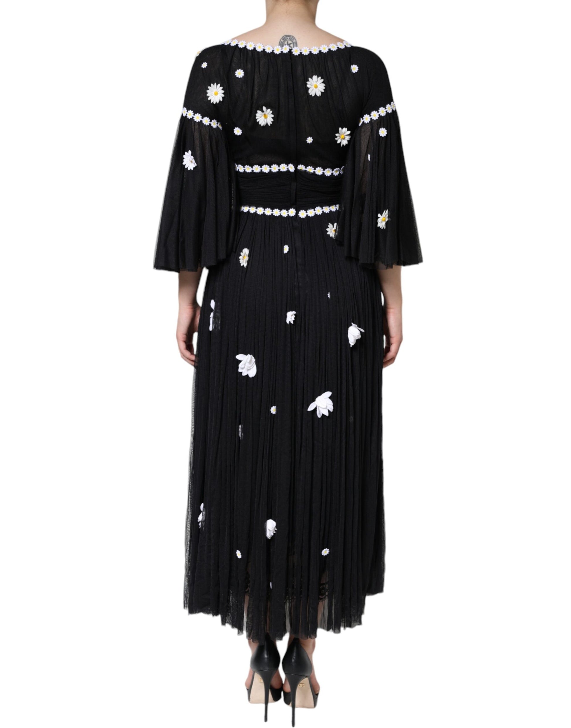 Black silk dress with daisy embroidery and fringe detailing