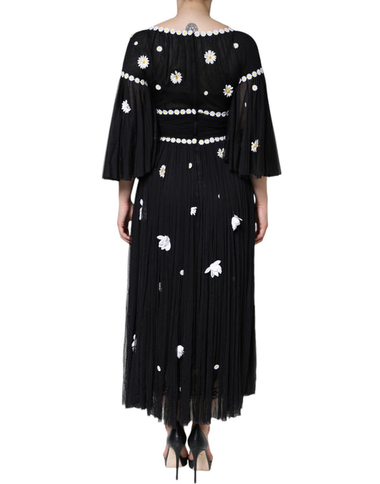 Black silk dress with daisy embroidery and fringe detailing