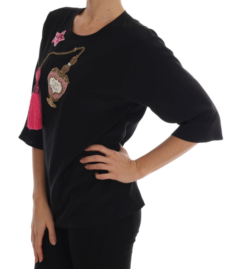 Black long sleeve shirt with pink and gold embroidery on front