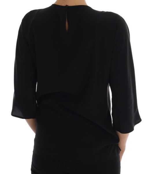 Black long sleeve blouse with ruffled back