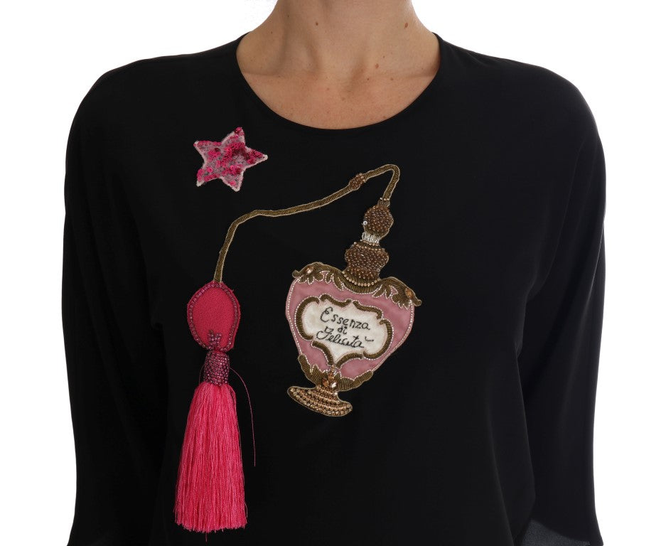 Black shirt with pink perfume bottle embroidery
