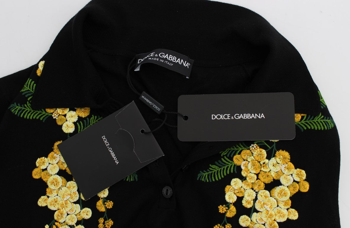 Black sweater with yellow flower pattern on front