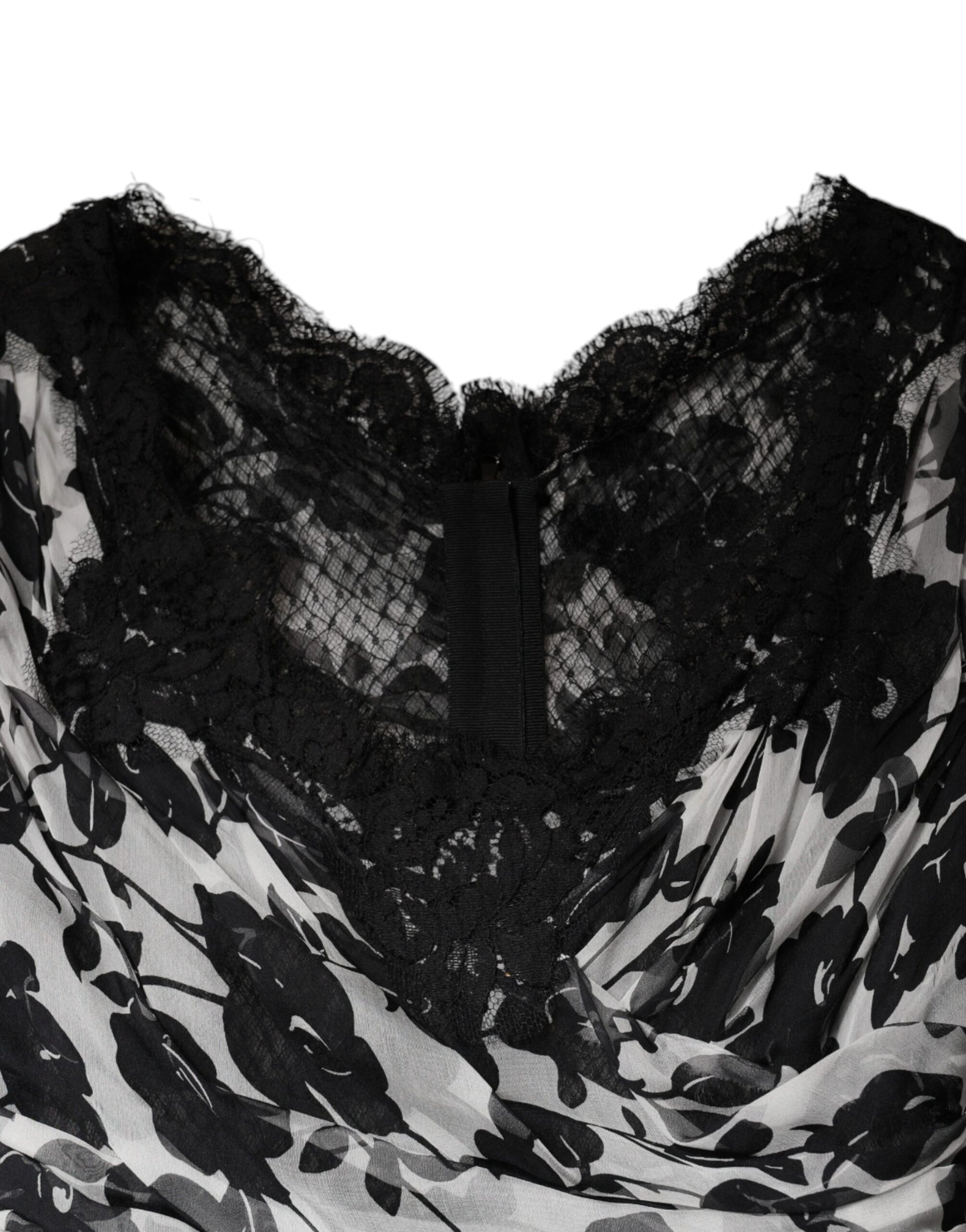 A black lace dress with floral patterns and ricamo detailing