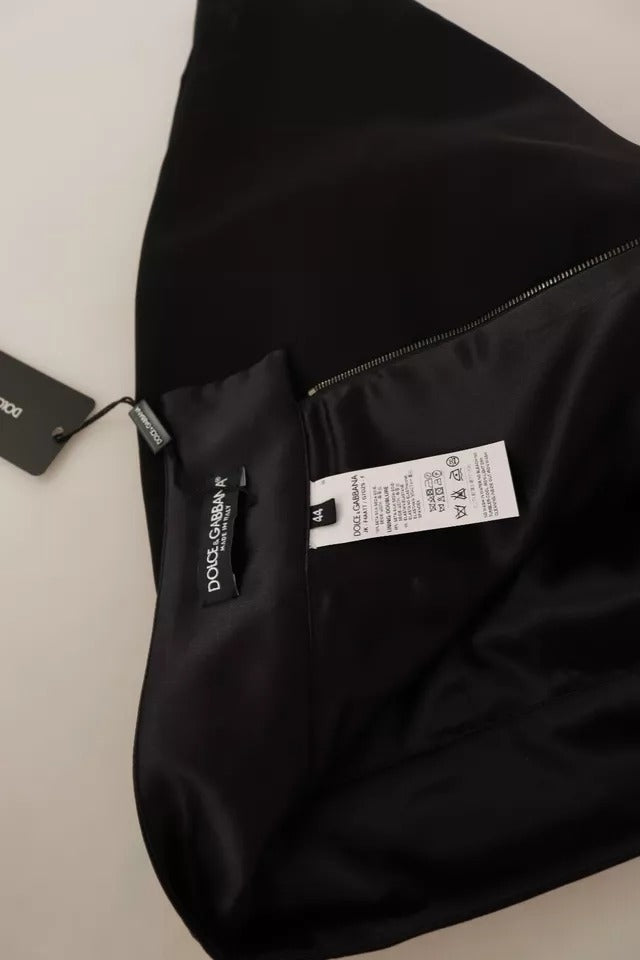 Black jacket on hanger with tag attached to zipper