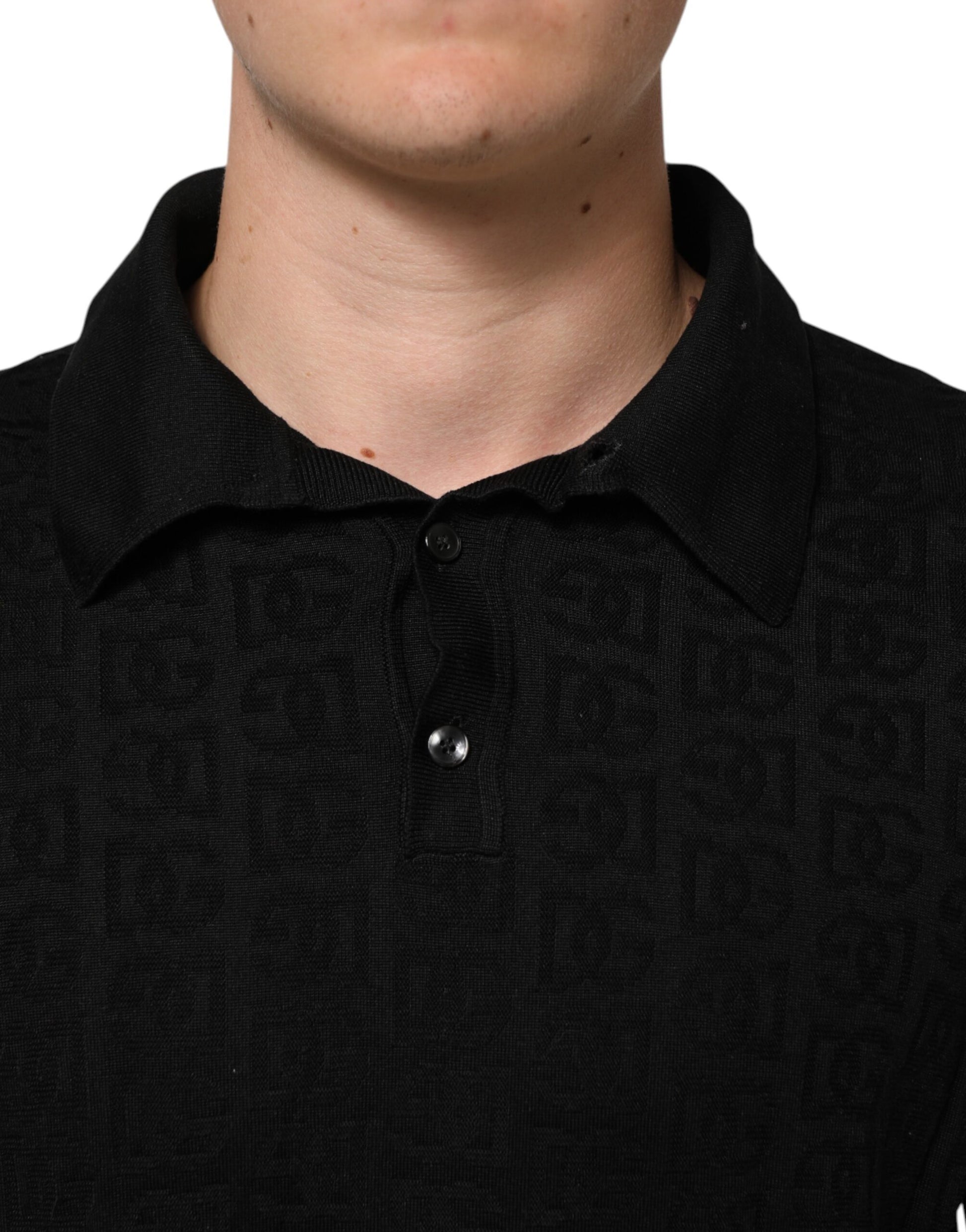 Man wearing black polo shirt