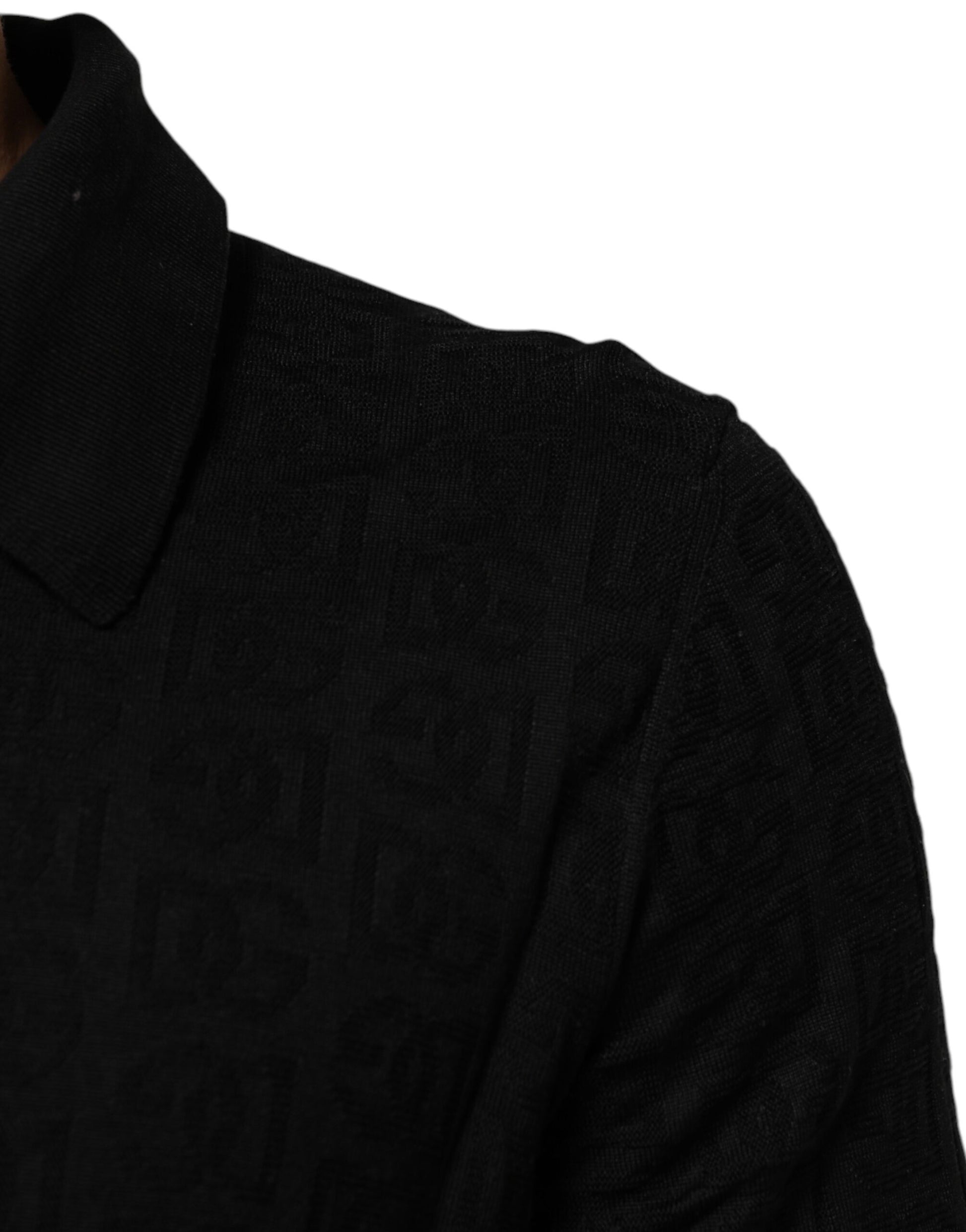 A person wearing a dark shirt with some pattern or design on it