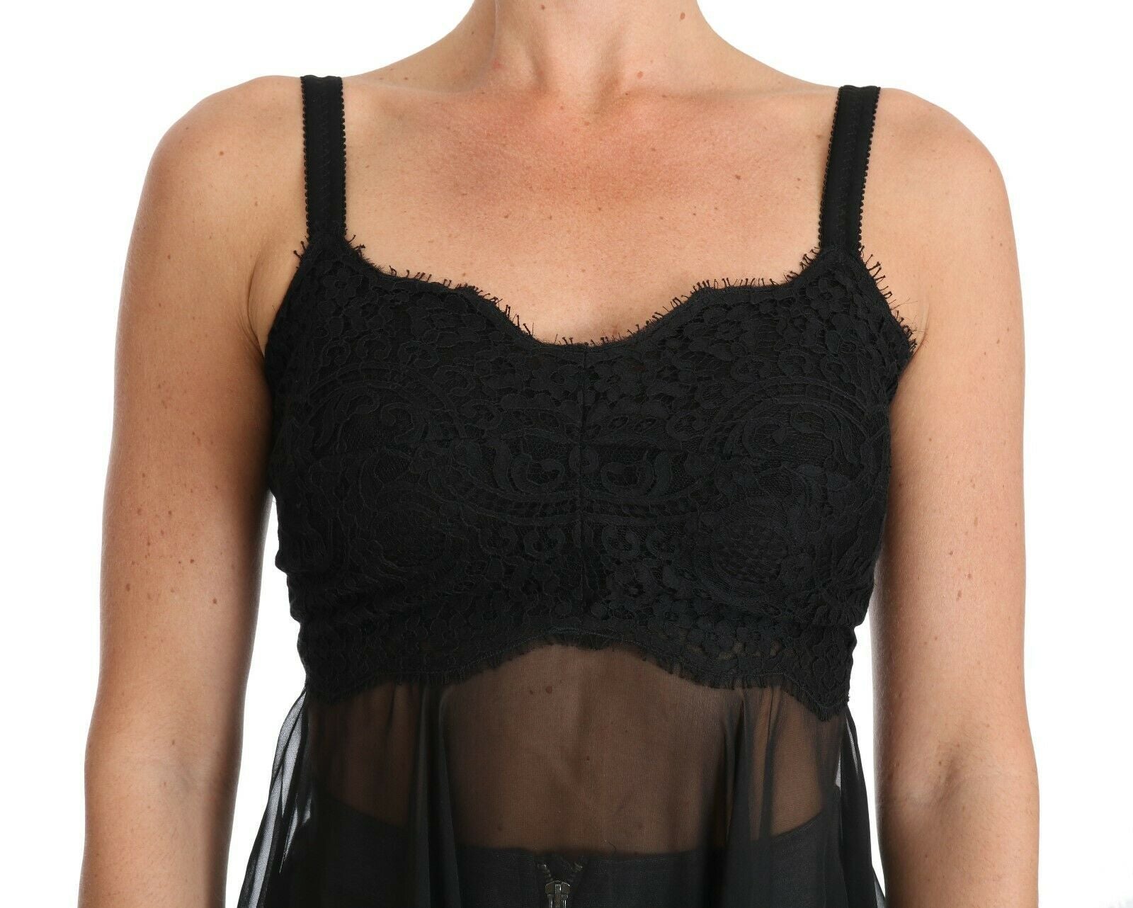 A black lace dress with a sheer overlay, featuring intricate lace detailing