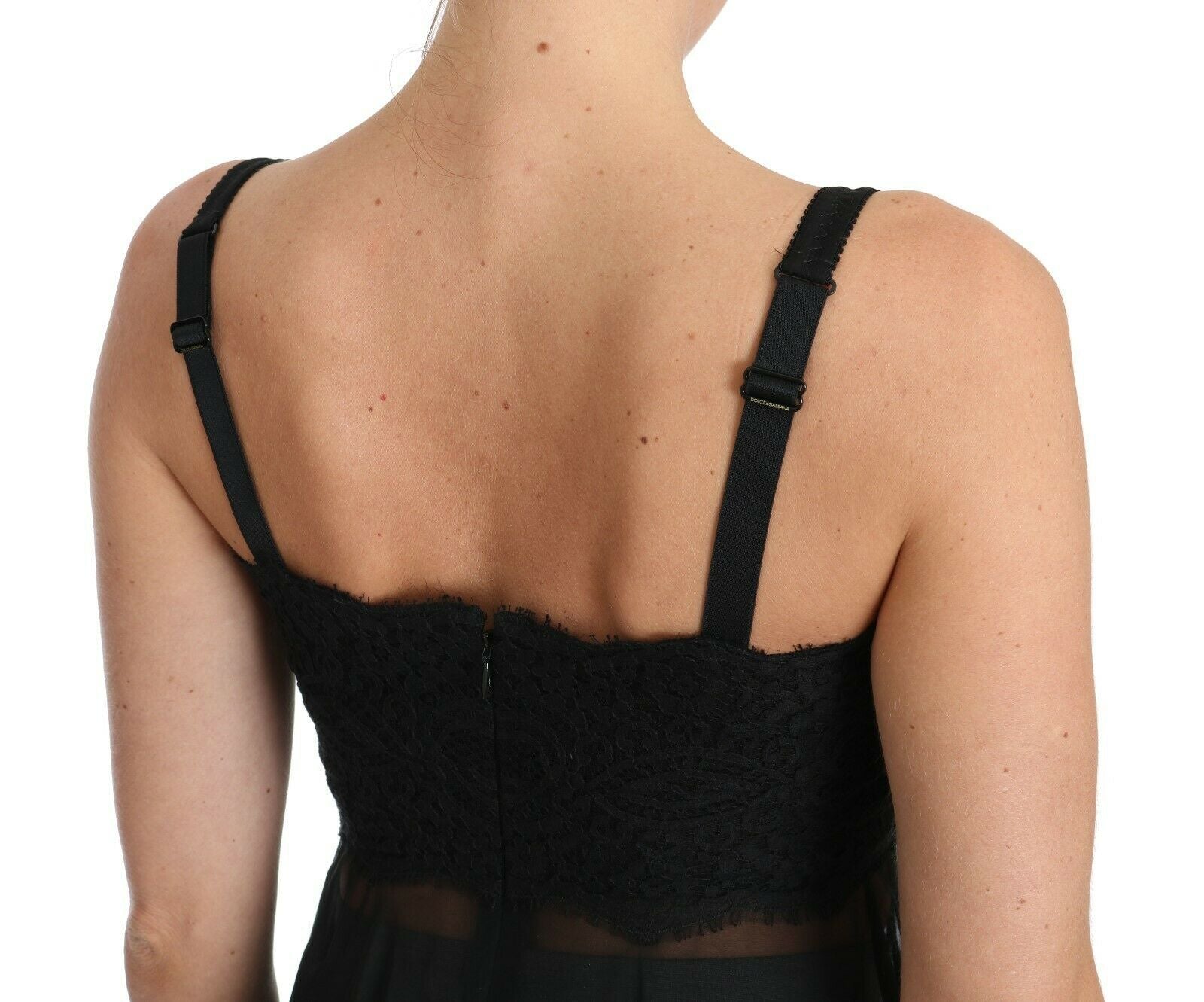 A black lace dress with a sheer silk chemise underneath, from the brand Dolce & Gabbana