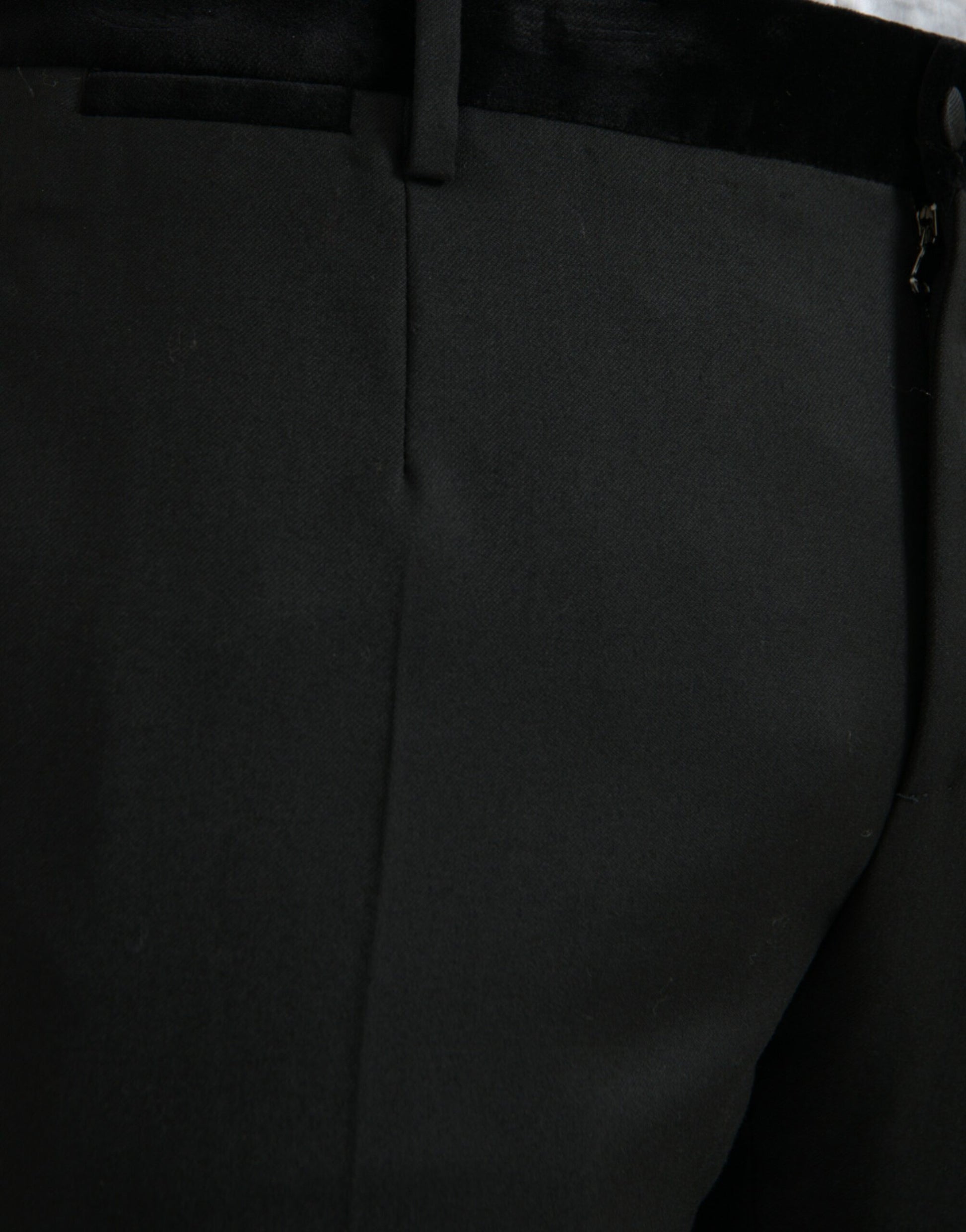 A pair of black silk men's skinny dress pants from the brand Dolce & Gabbana