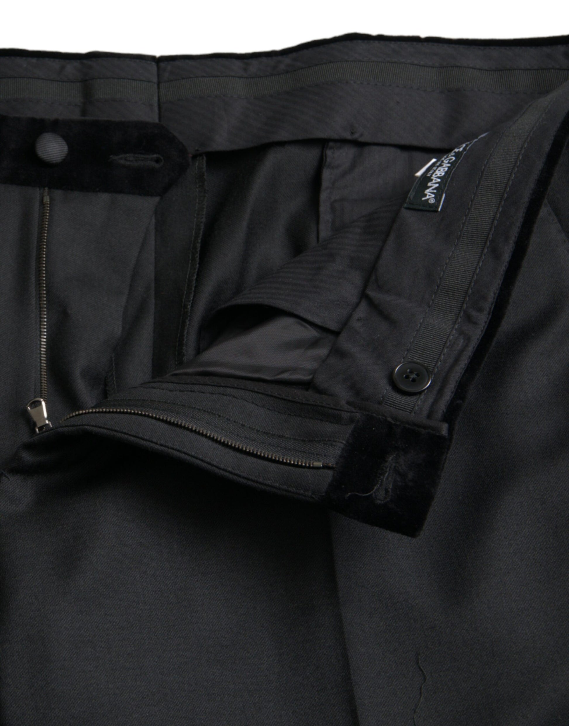 A pair of black silk men's skinny dress pants with a zippered front
