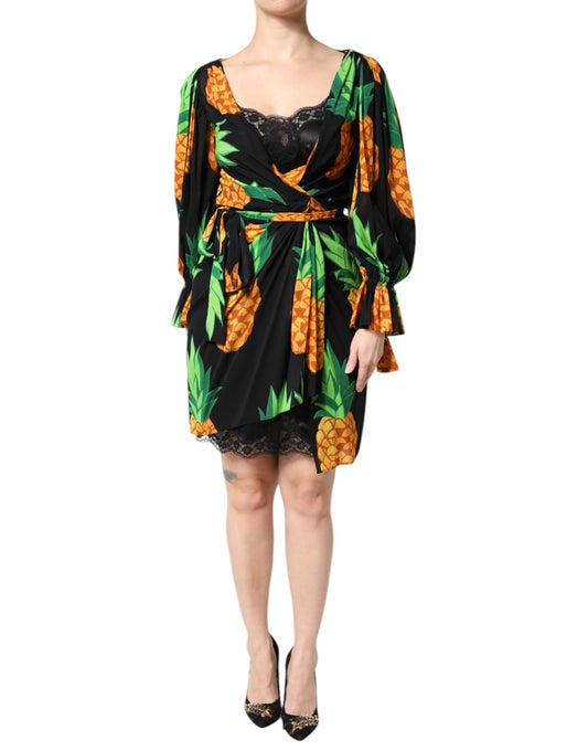 A black silk dress with a pineapple print and draped design