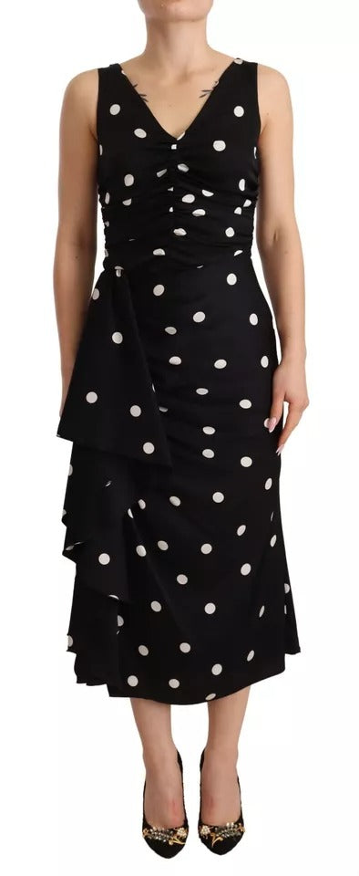 A black silk midi dress with polka dots and a V-neck